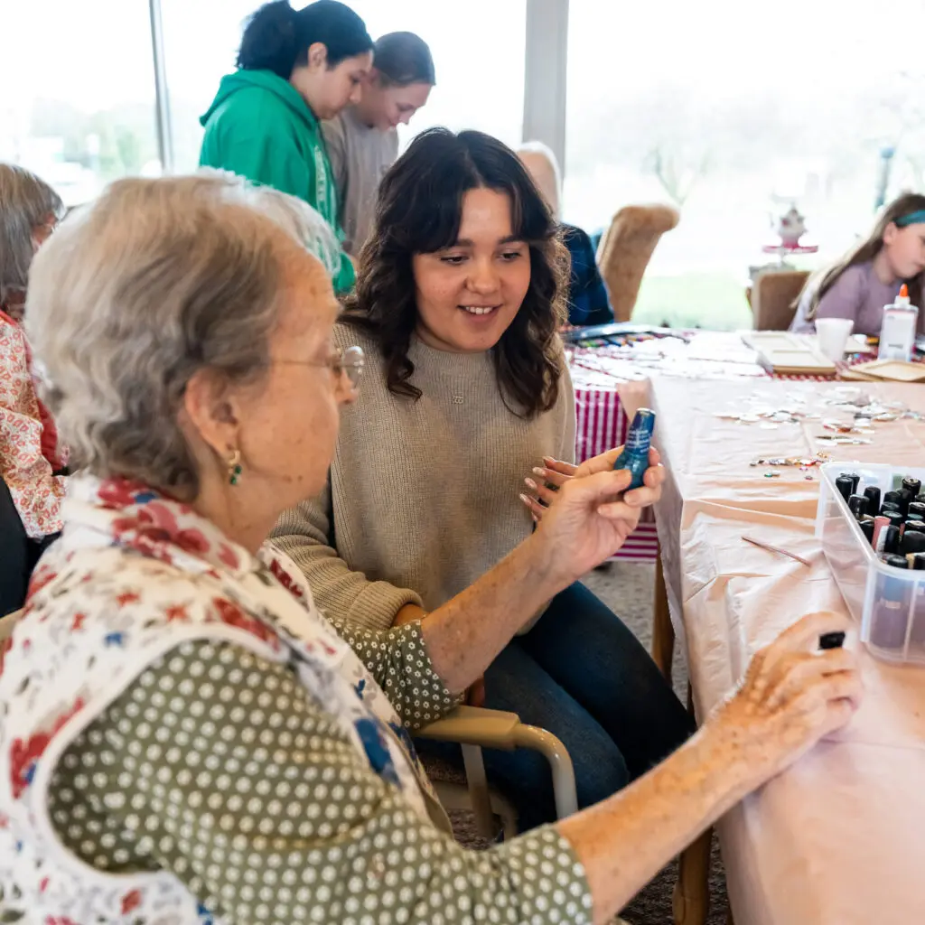 A resident participates in an art project at The Willows personal care home in Montgomery County.