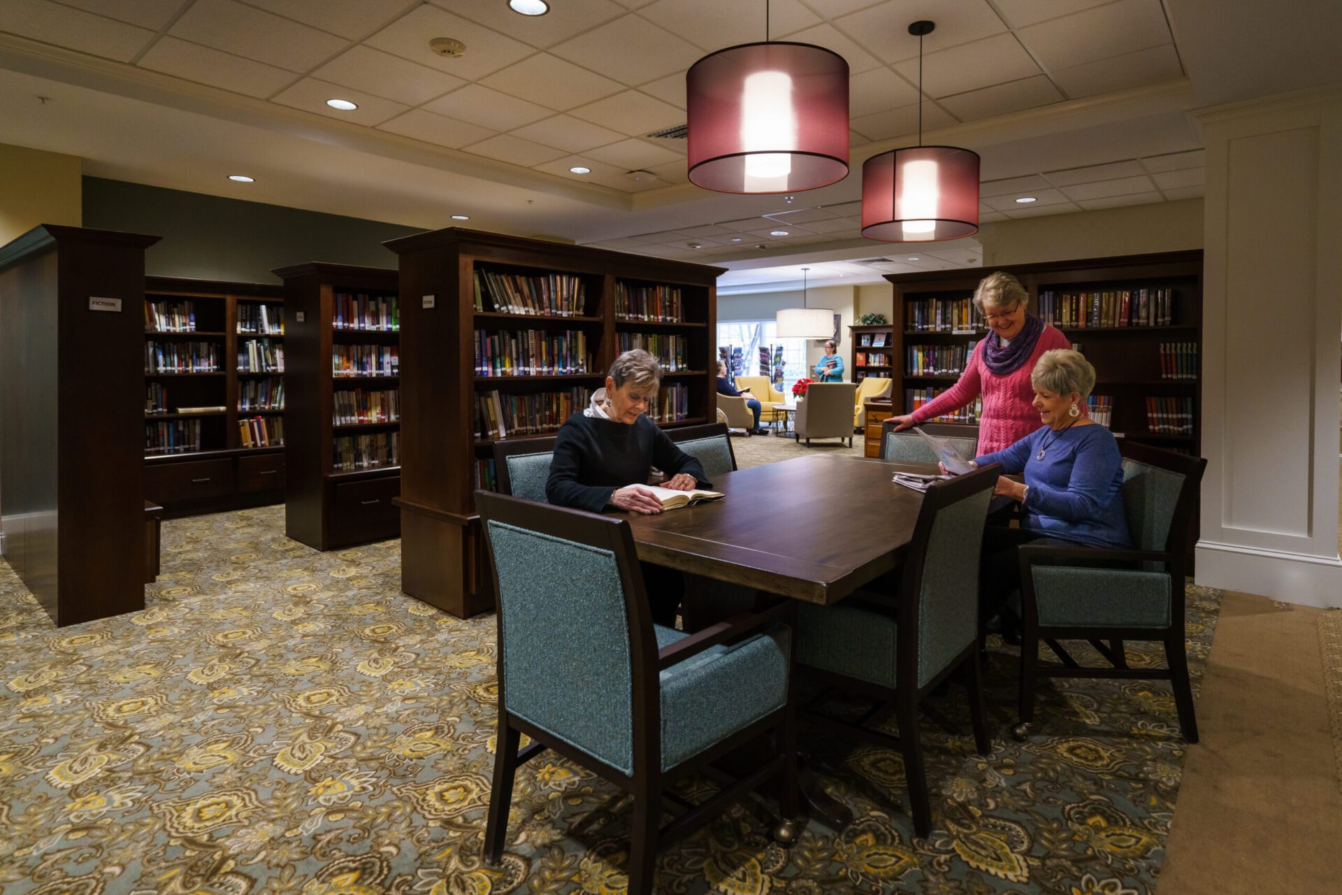 Residents enjoy the library at the Dock Woods senior living community in Lansdale