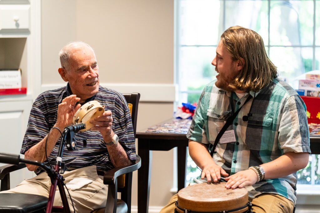 A Personal Care resident at Dock Woods engages with a creative arts therapist