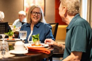 Two residents enjoy an upscale meal in one of Living Branches’ campus restaurants.