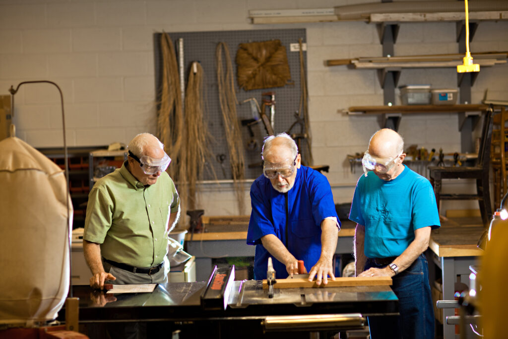 Senior living residents regularly work on carpentry projects in the Dock Woods shop