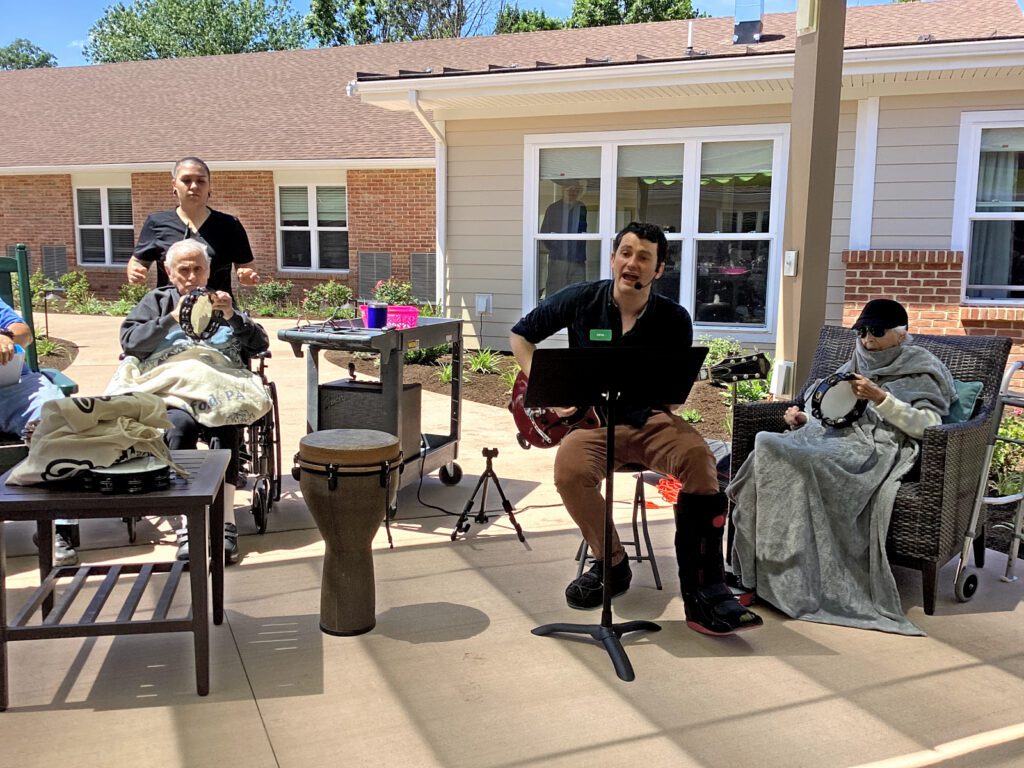 A creative arts therapist provides a group session in the Memory Care community at Dock Woods in Lansdale