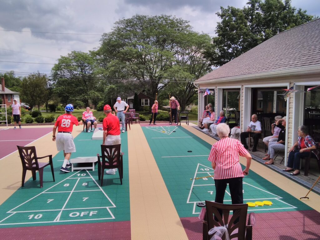 Residents enjoy outdoor shuffleboard at the Souderton Mennonite Homes senior living community in Souderton